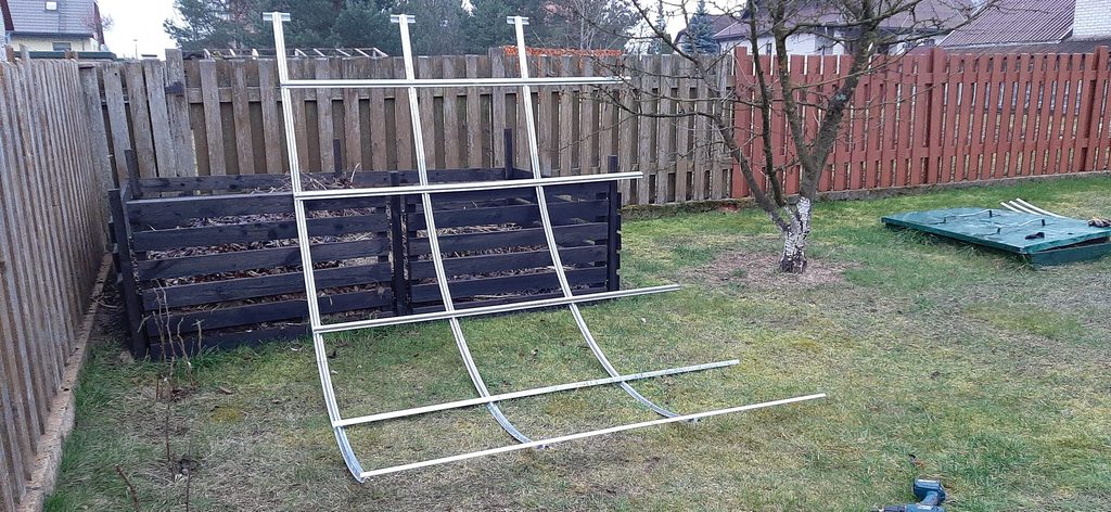 First greenhouse extension frame section assembled on the ground