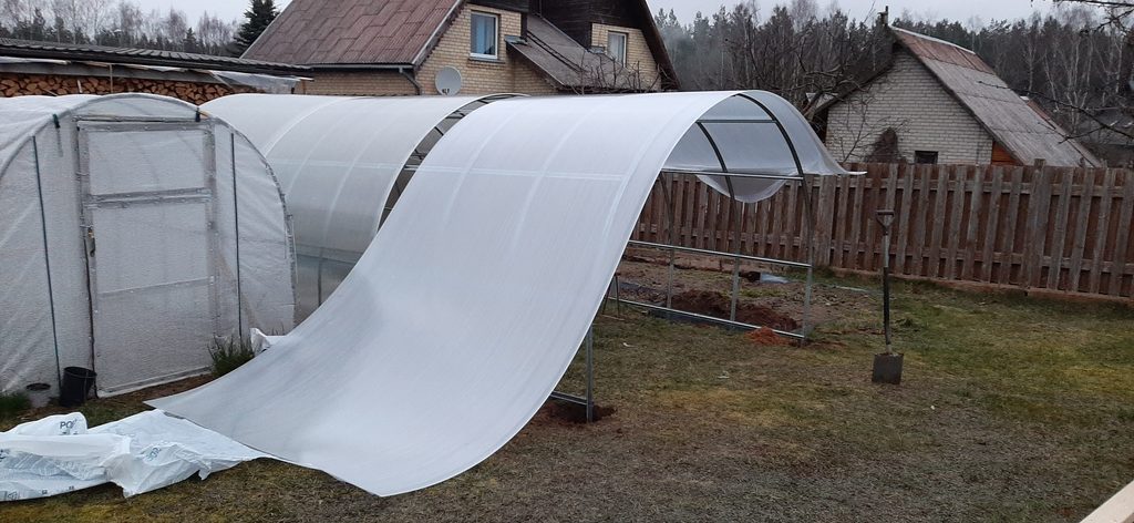 Adjusting polycarbonate sheet on greenhouse extension
